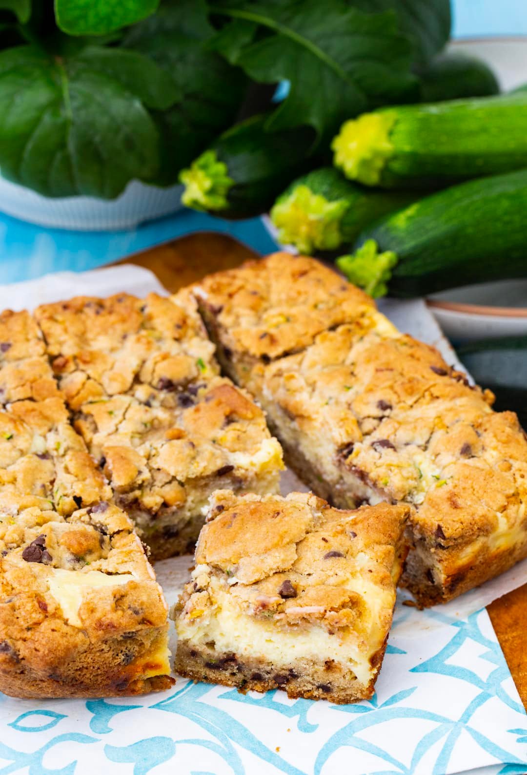 Zucchini Cheesecake Bars cut into squares.