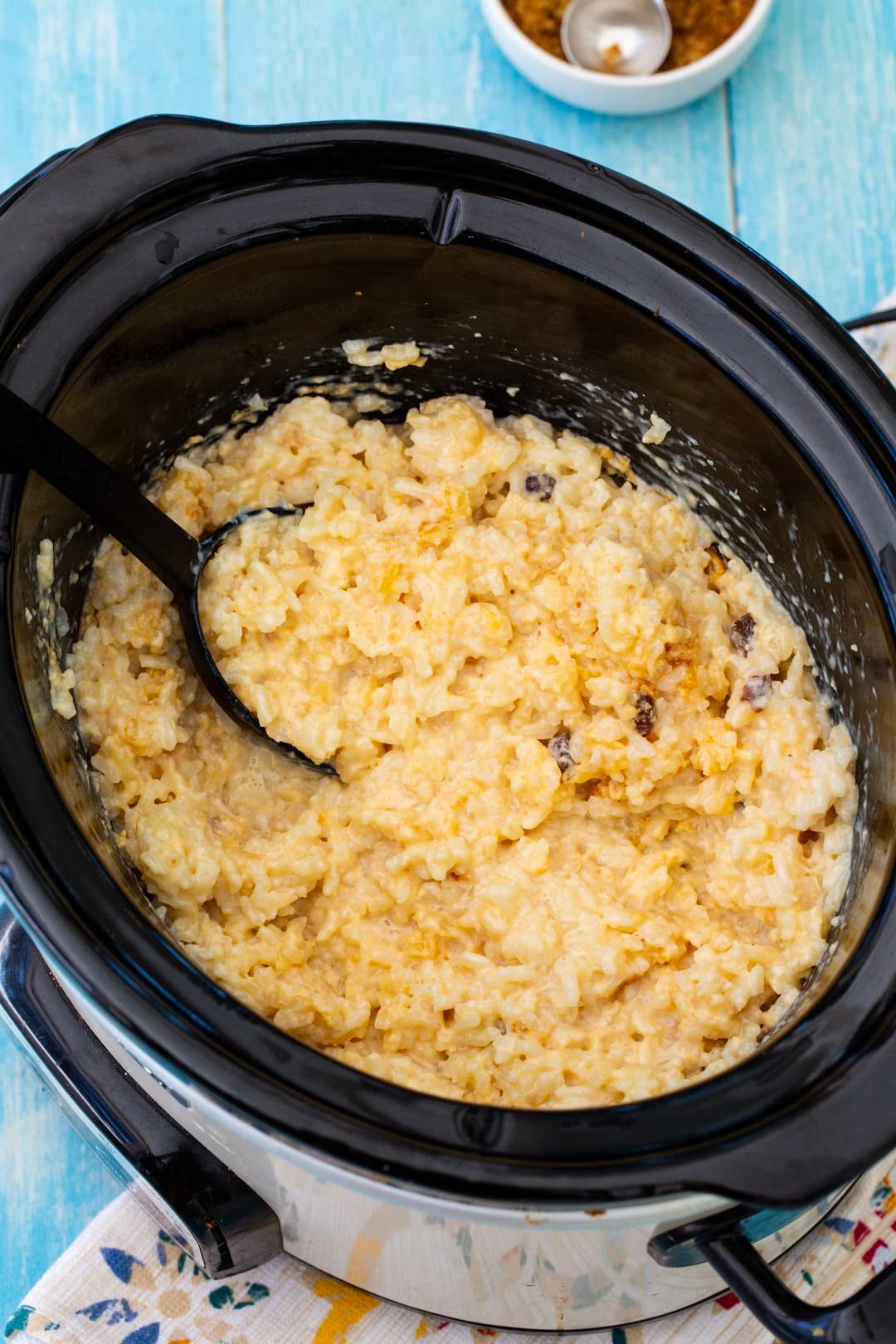 Rice pudding in slow cooker after being stirred.