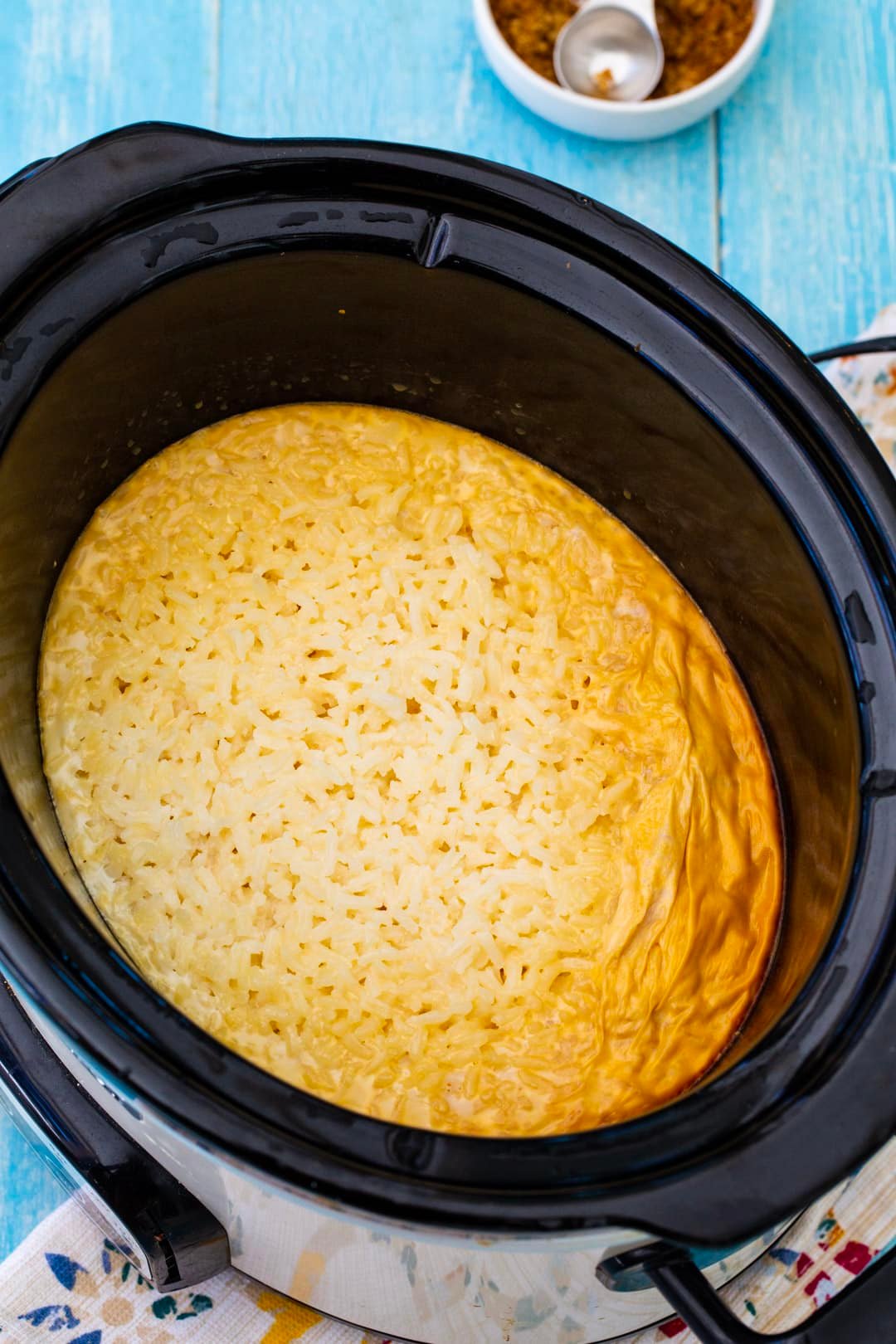 Rice pudding in slow cooker after being cooked.