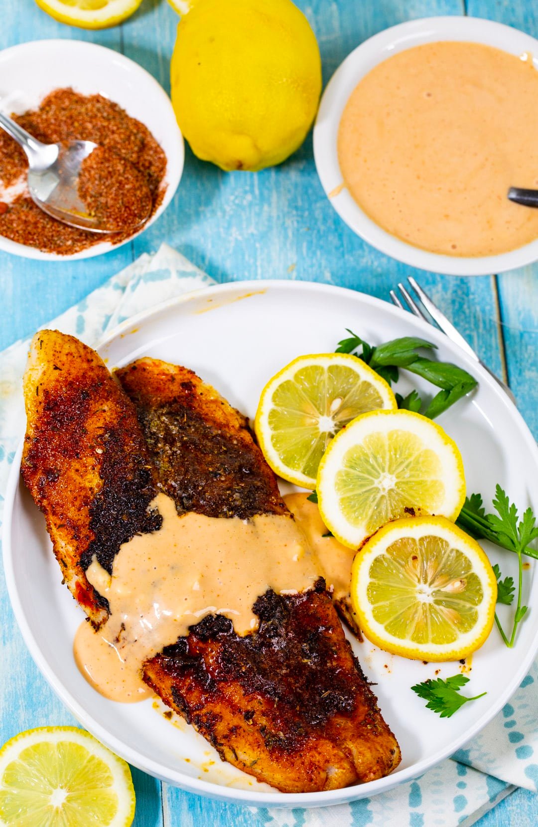 Blackened Catfish covered with Comeback Sauce on a plate.