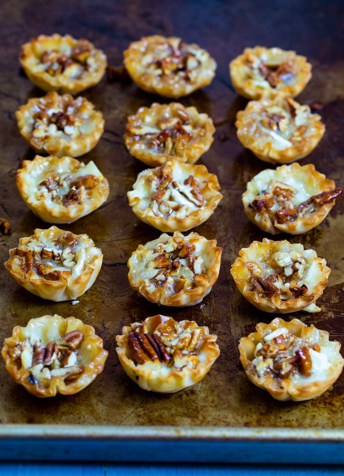 Bourbon Pecan Brie Bites on baking sheet.