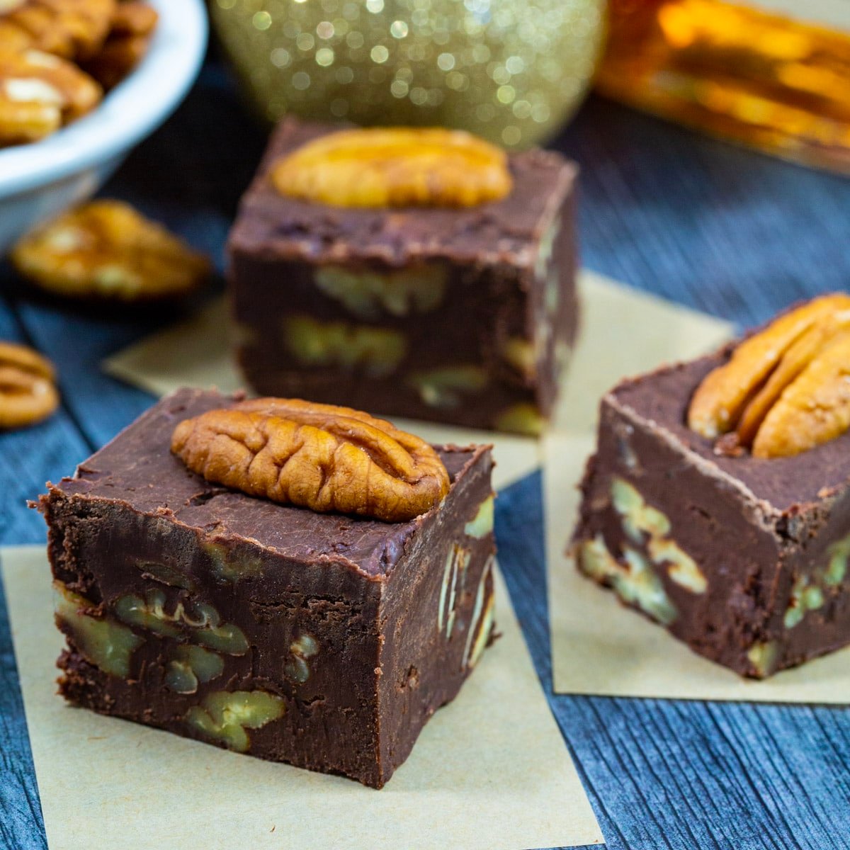 Bourbon Pecan Fudge pieces topped with pecan halves.