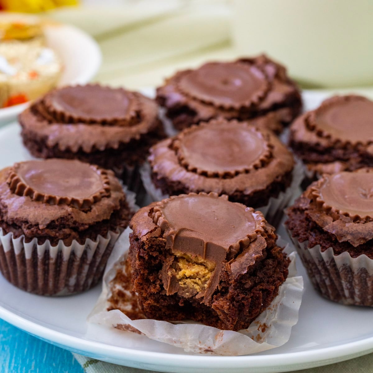 Brownie Buttons on a plate with a bite taken out of one.