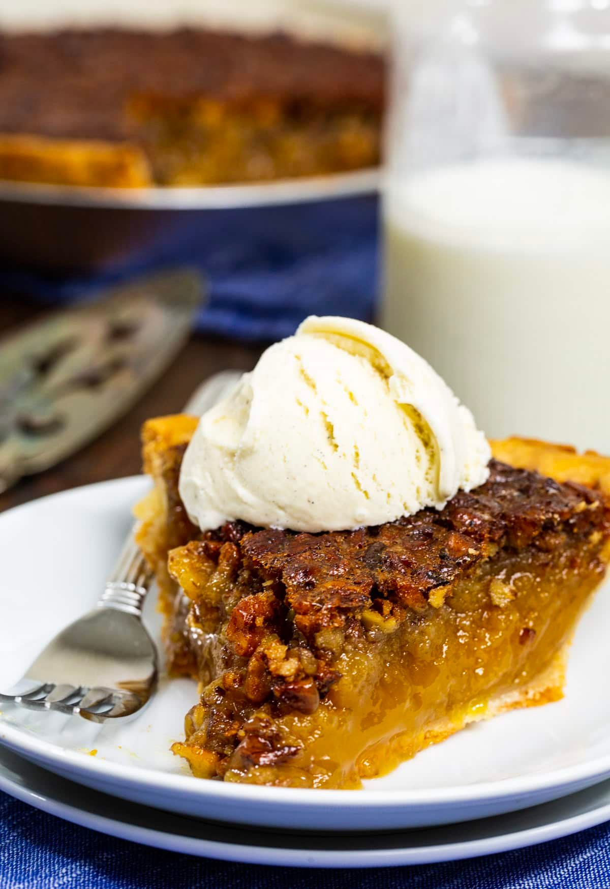 Slice of pie with a scoop of vanilla ice cream.