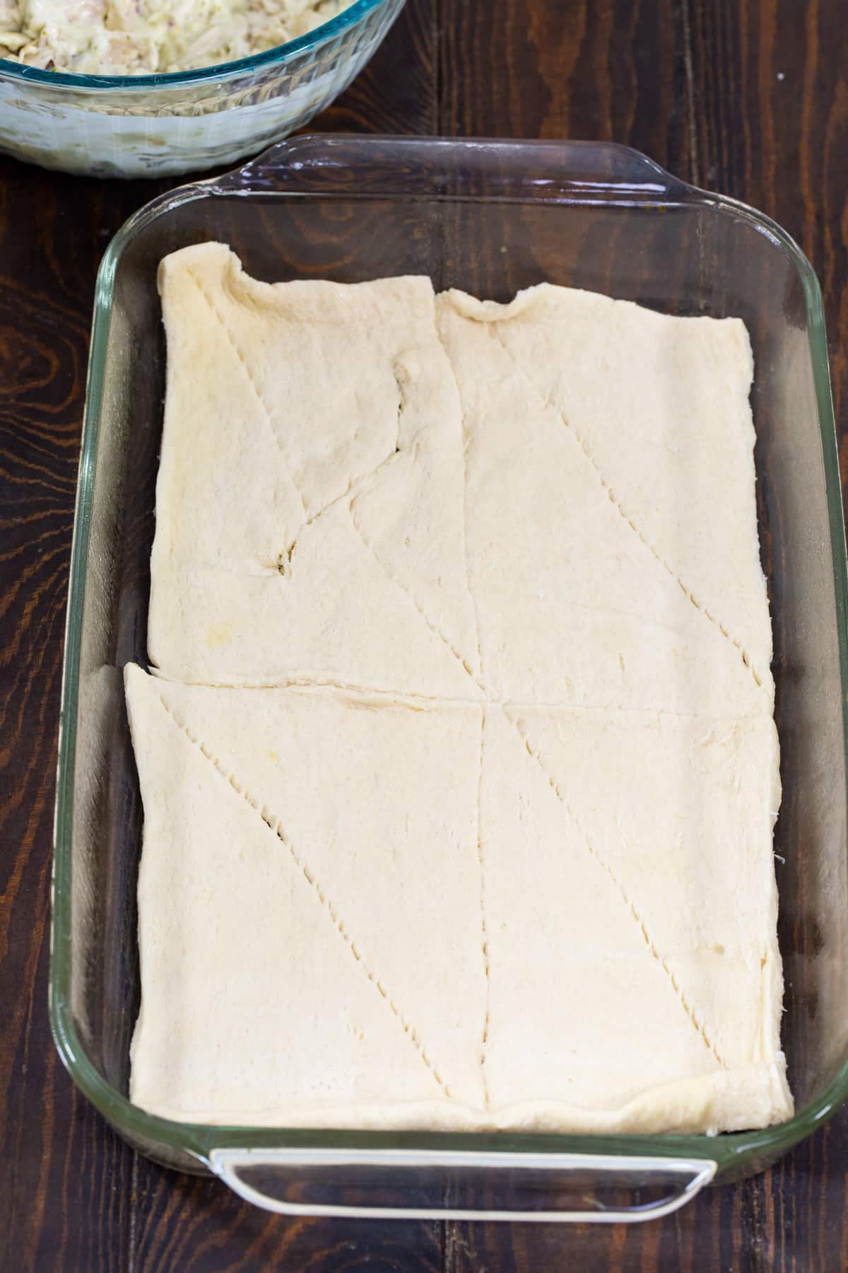 Crescent dough spread in bottom of baking pan.