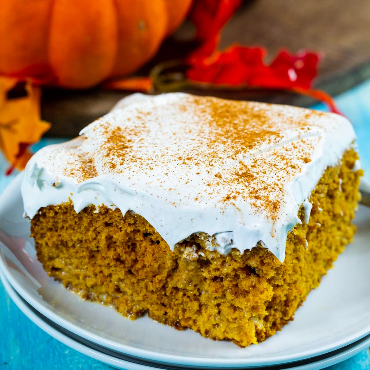 Slice of Pumpkin Tres Leches Cake on a plate.