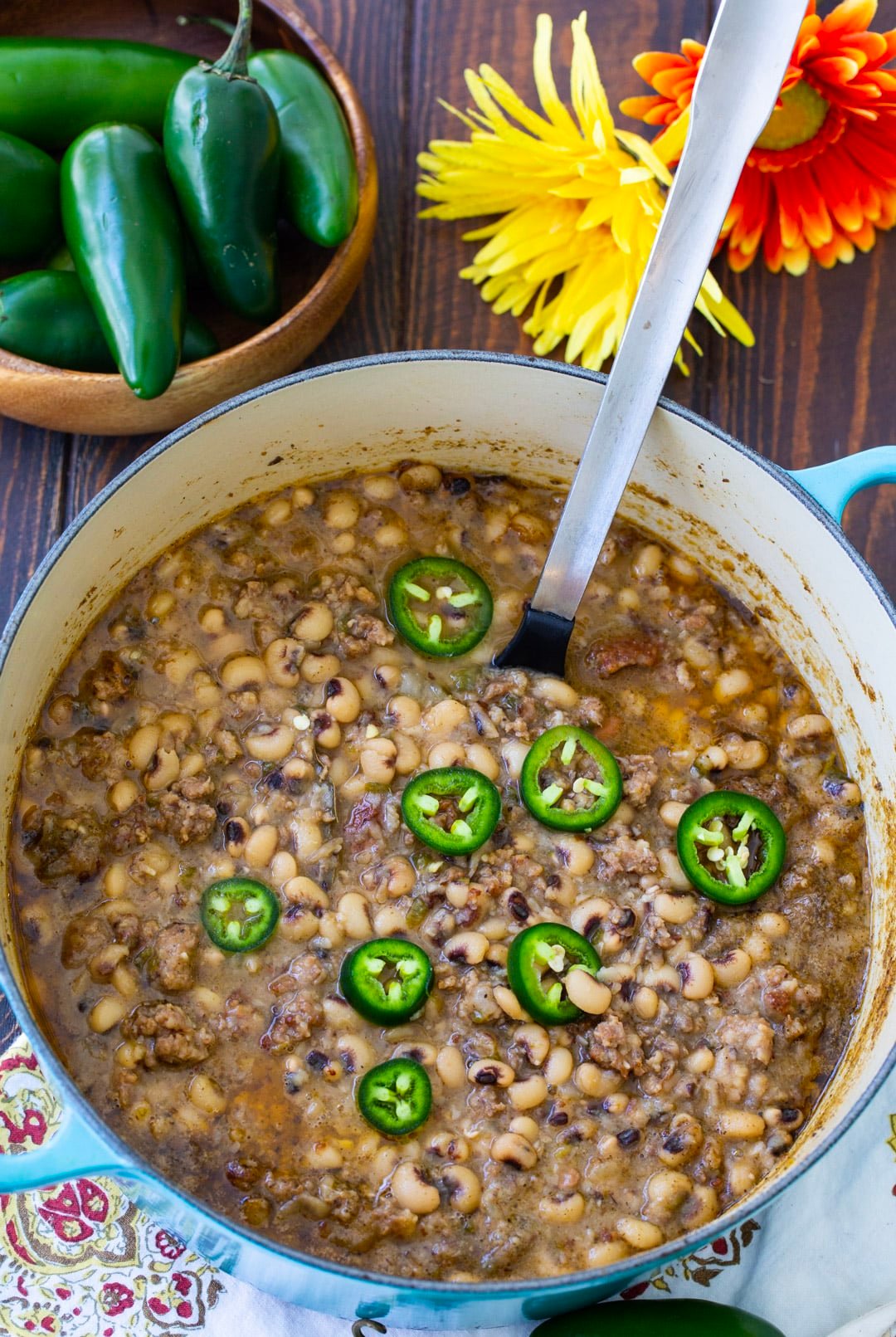 Spoon scooping up black-eyed peas.