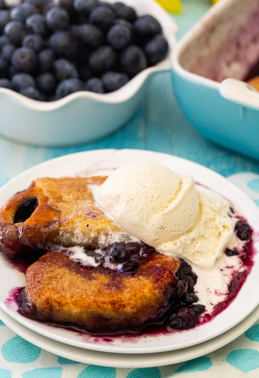Blueberry Dumplings topped with ice cream.