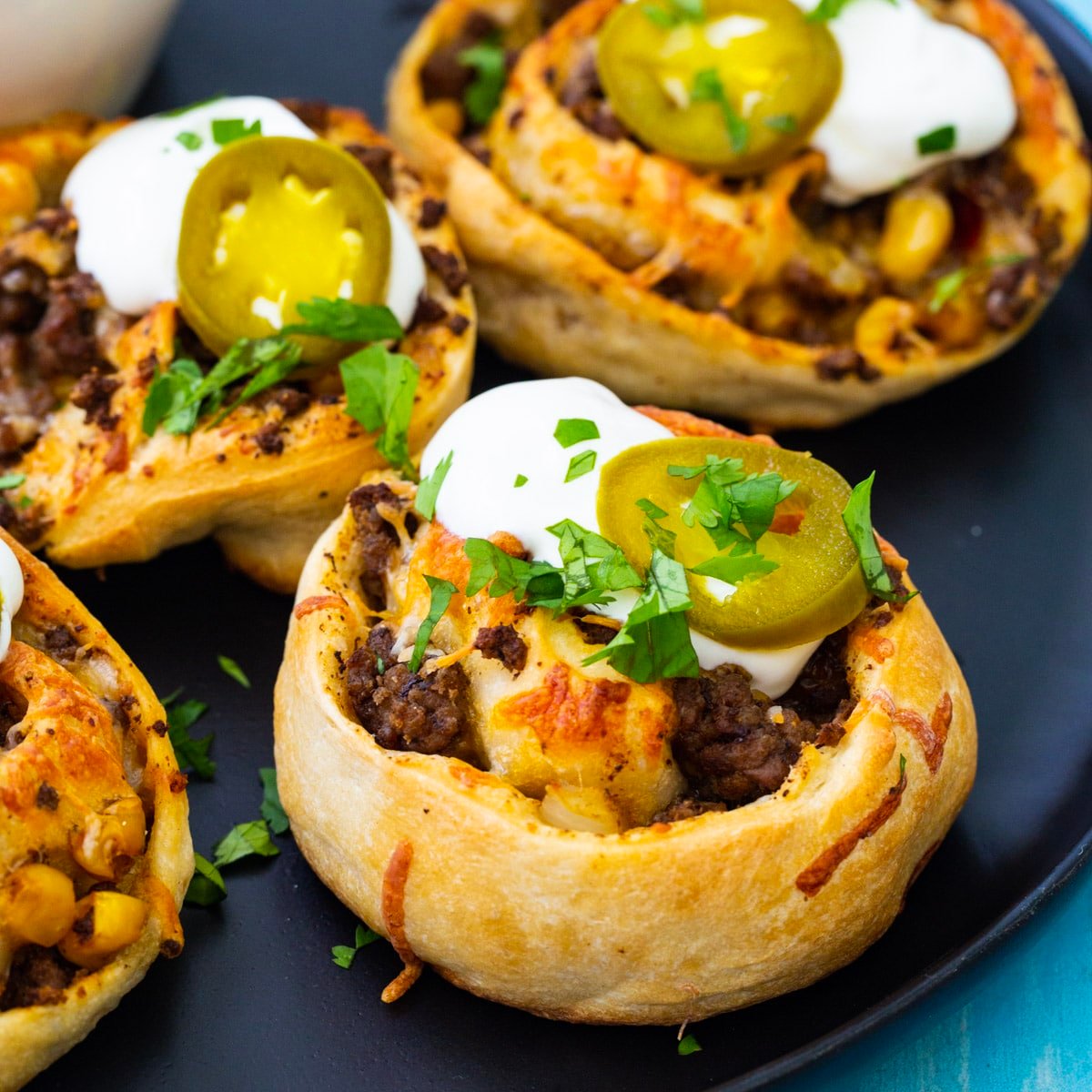 Taco Pizza Rolls on a plate.