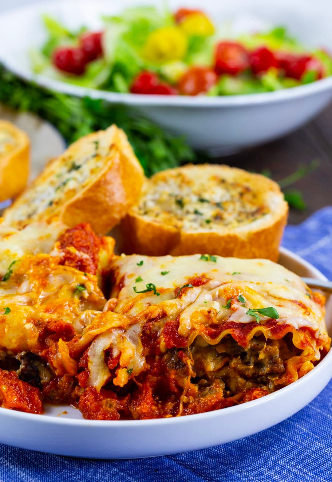 Roll-Up dished up on a plate with garlic bread.