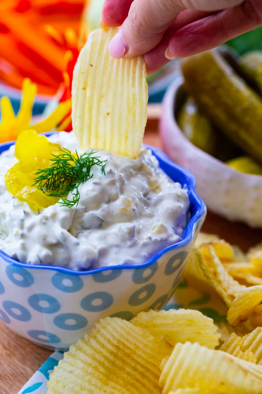 Chip being dipped into dip.