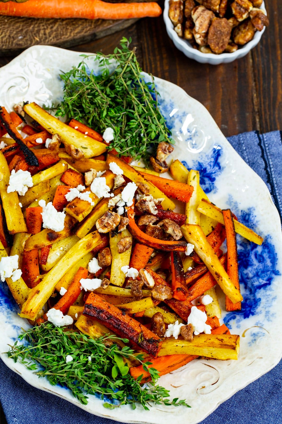 Roasted carrots and parsnips on serving plate.