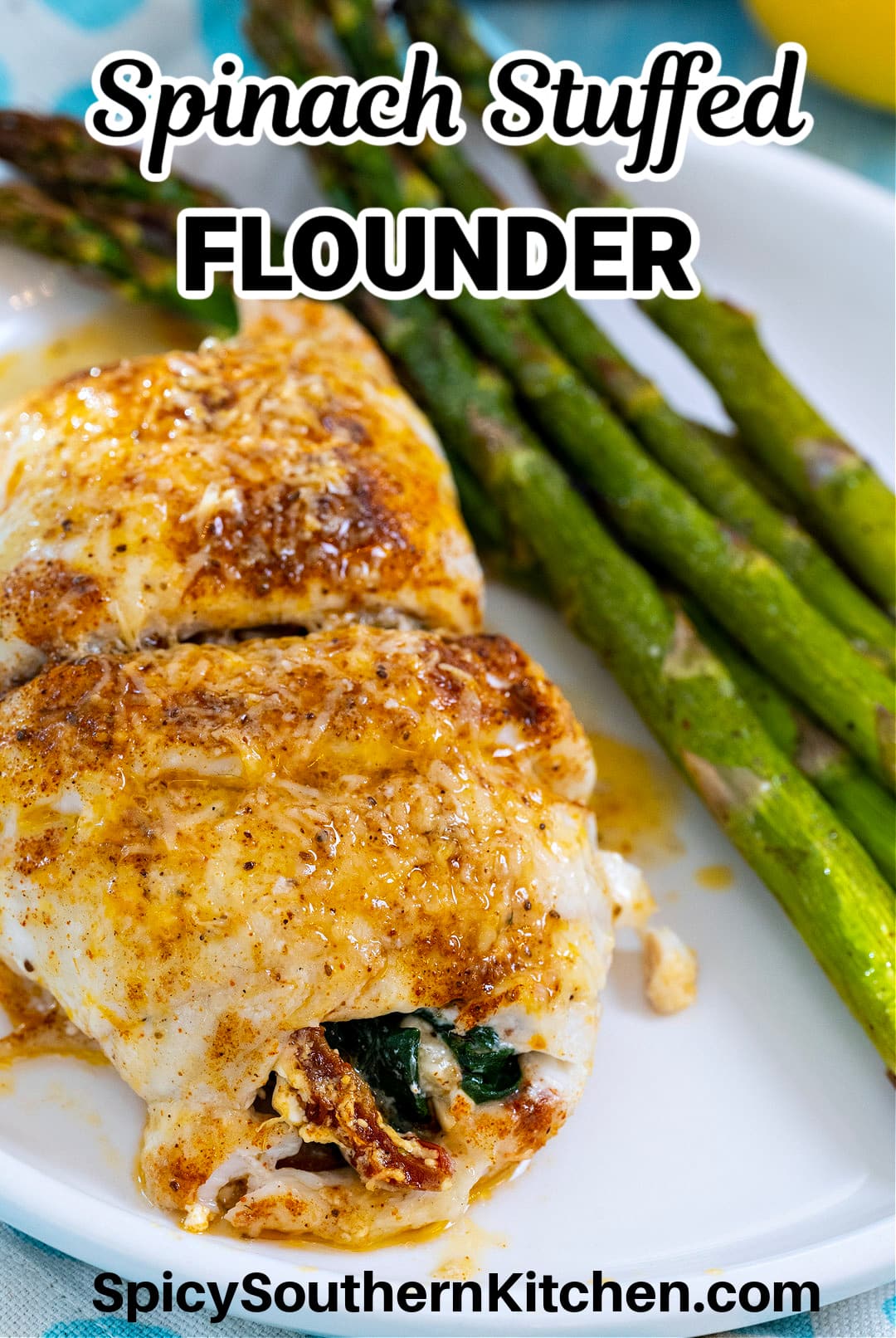 Spinach Stuffed Flounder on plate with asparagus.