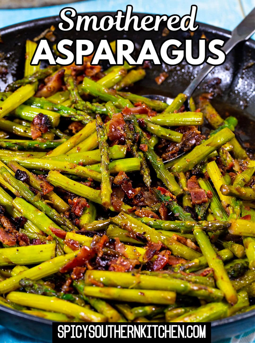Smothered Asparagus in a skillet.