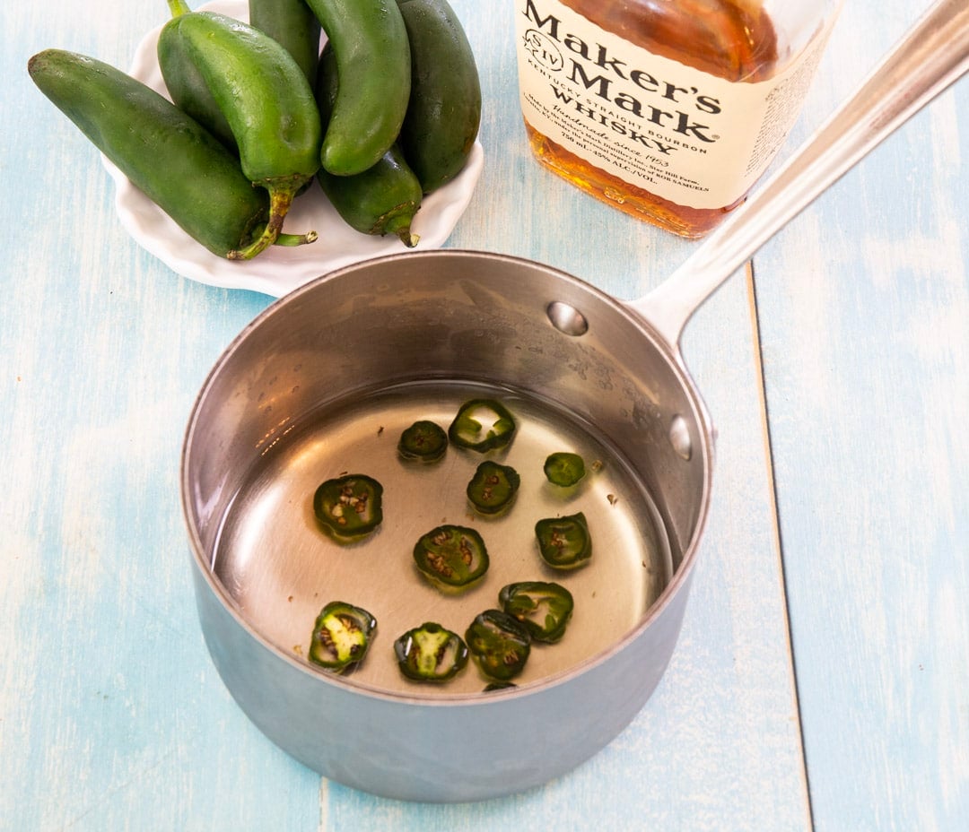 Jalapeno simple syrup in a saucepan.