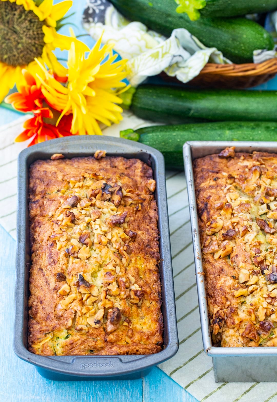 Two Loaves of zucchini bread in baking pans.