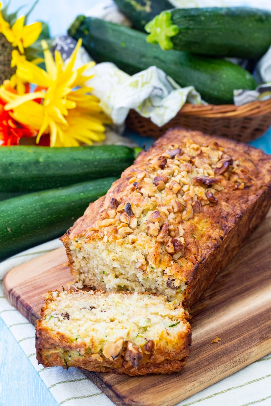 Loaf of zucchini bread with a slice cut.