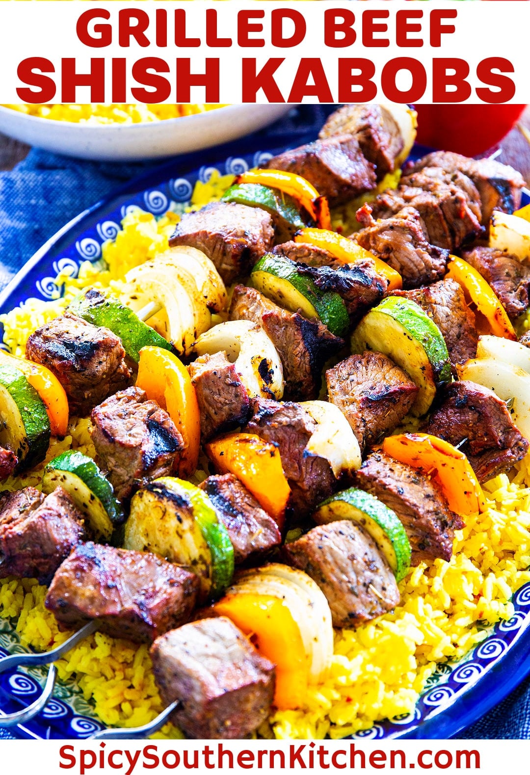 Grilled Beef Shish Kabobs over yellow rice.
