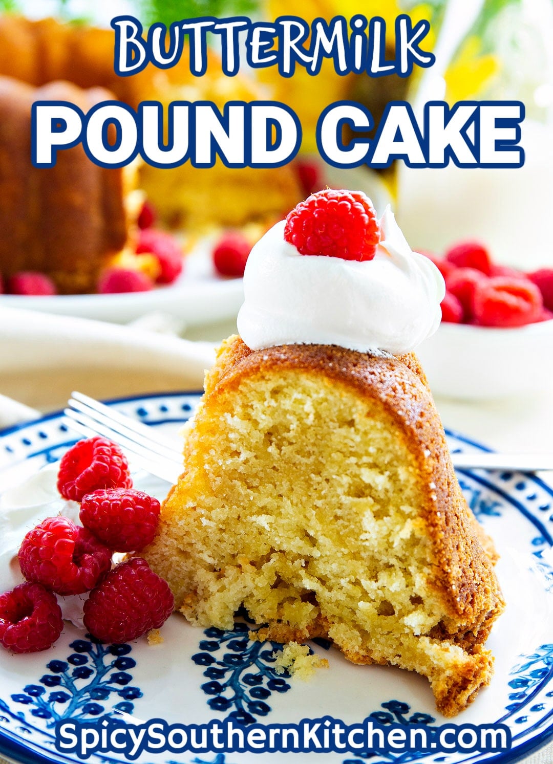 Slice of pound cake on a small plate with raspberries.