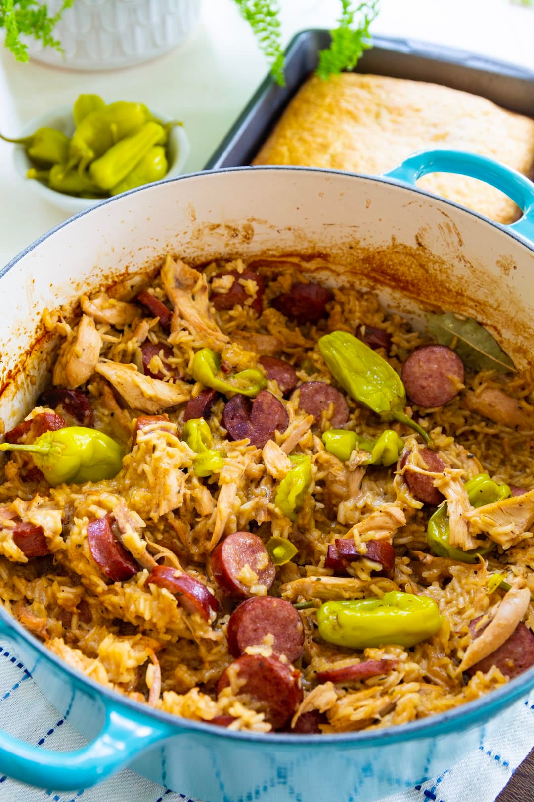 Chicken Bog with Pepperoncini Peppers in a Dutch oven.
