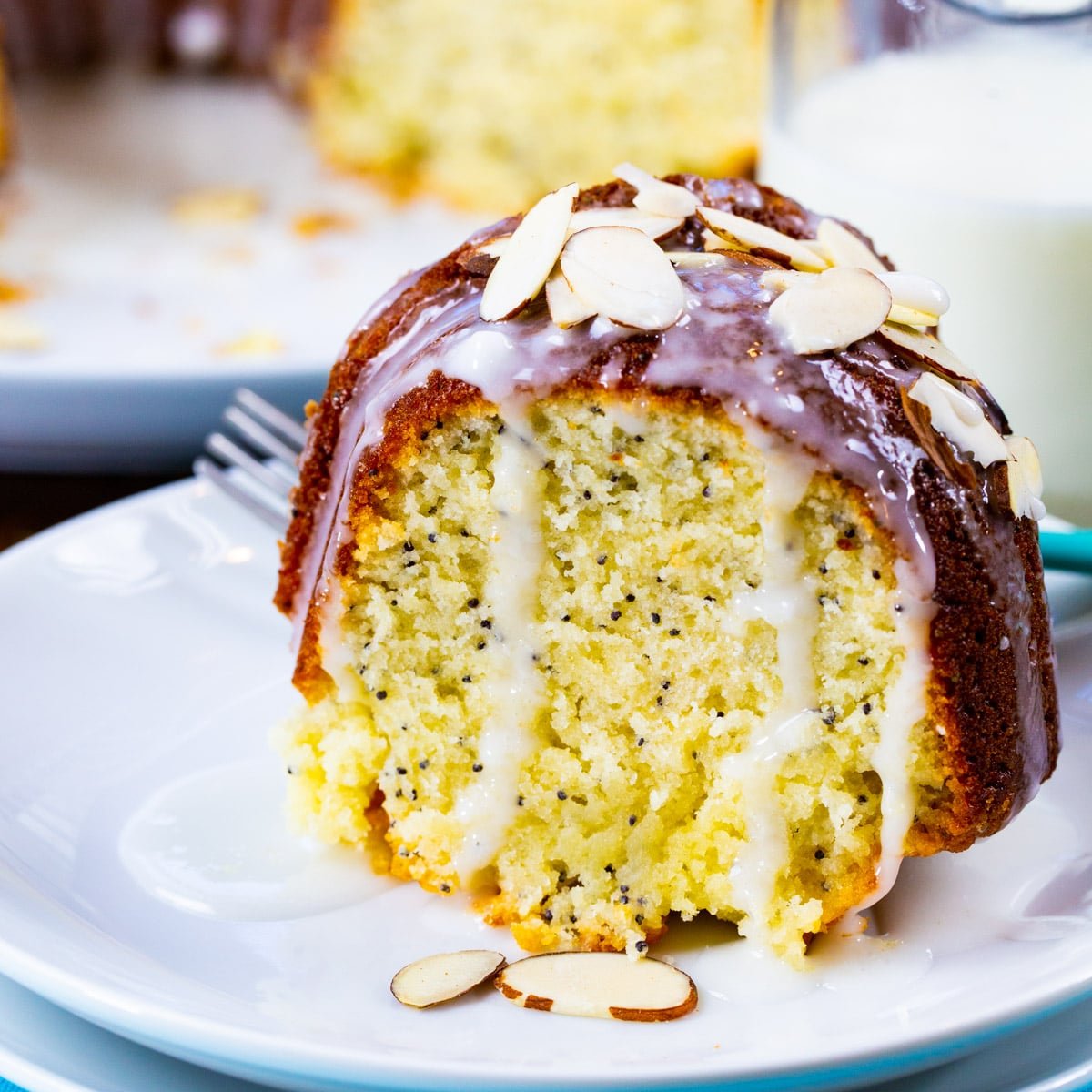 Slice of Almond Poppy Seed Pound Cake on a plate.