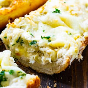 Artichoke and Crab Dip Bread with slice cut out.