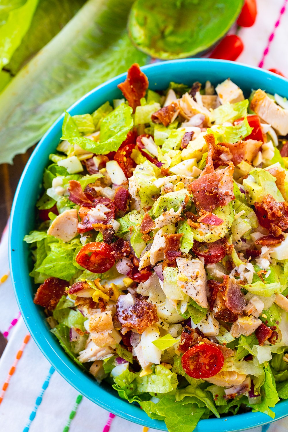 Chopped Cobb Salad in bright blue bowl.