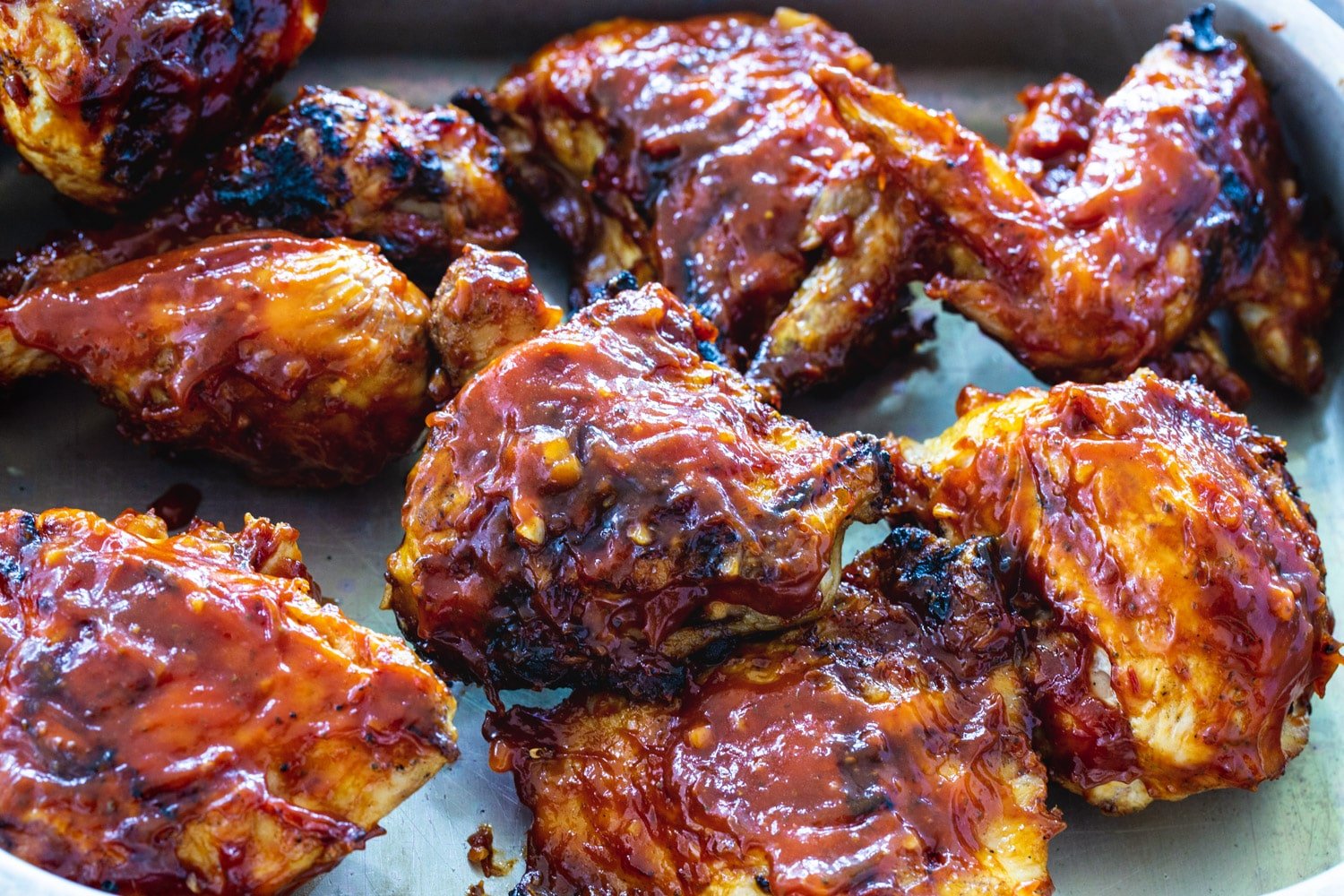 Pieces of BBQ Grilled Chicken in a pan.