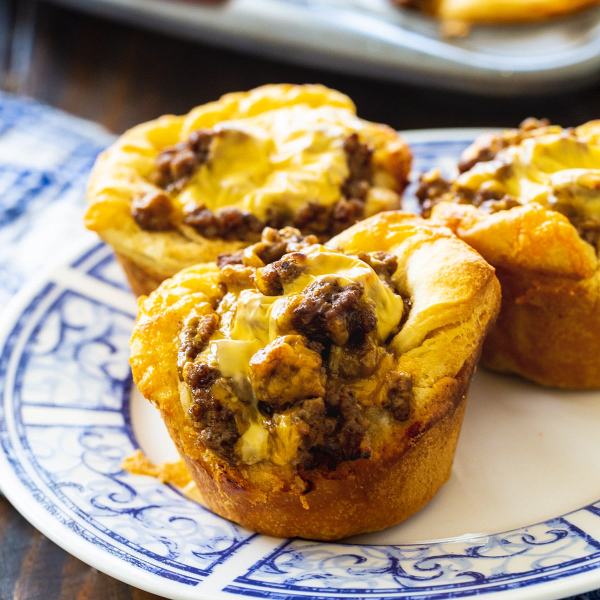 Three BBQ Ground Beef Biscuit Cups on a plate.