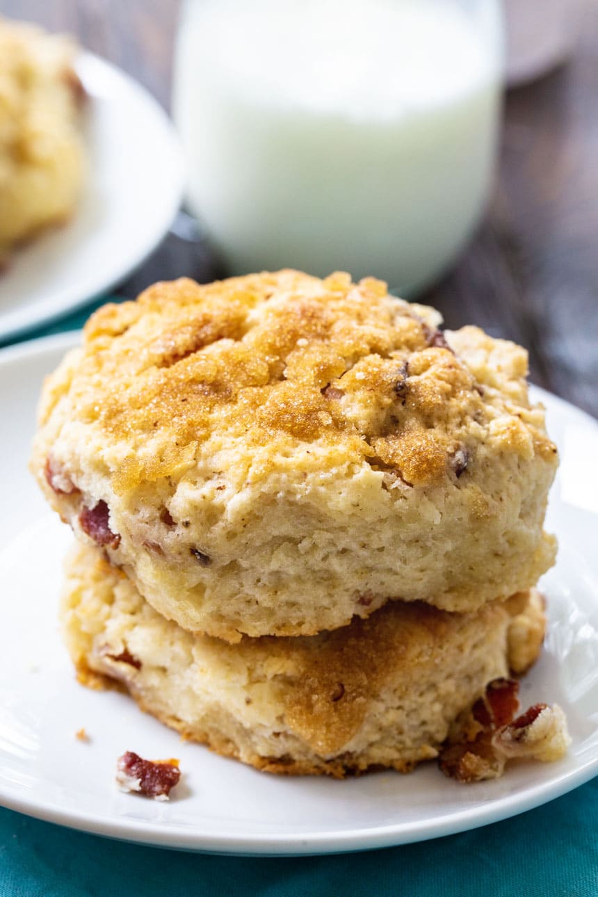 Bacon Brown Sugar Biscuits stacked on a white plate