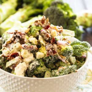 Broccoli Salad with Bacon and Blue Cheese in a white bowl.