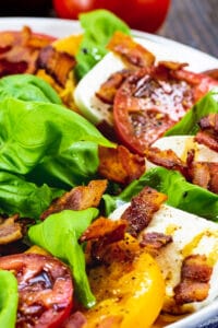 Bacon Caprese Salad on a large white plate.
