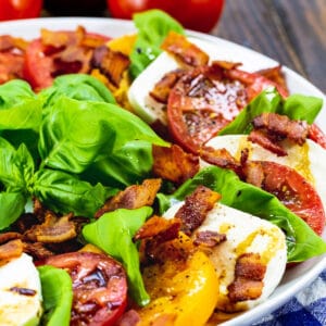 Bacon Caprese Salad on a large white plate.
