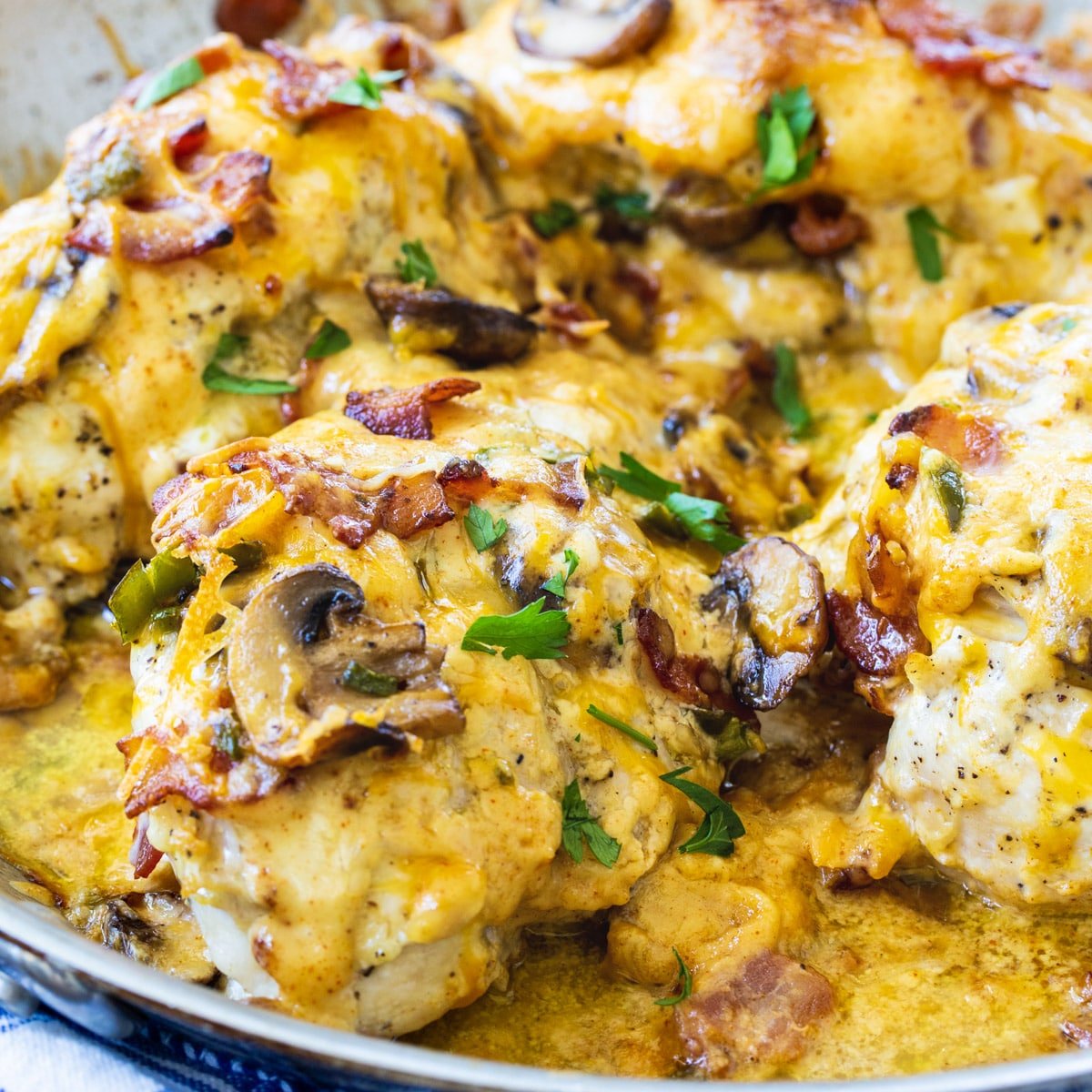 Bacon Mushrrom and Cheese Stuffed Chicken in skillet.
