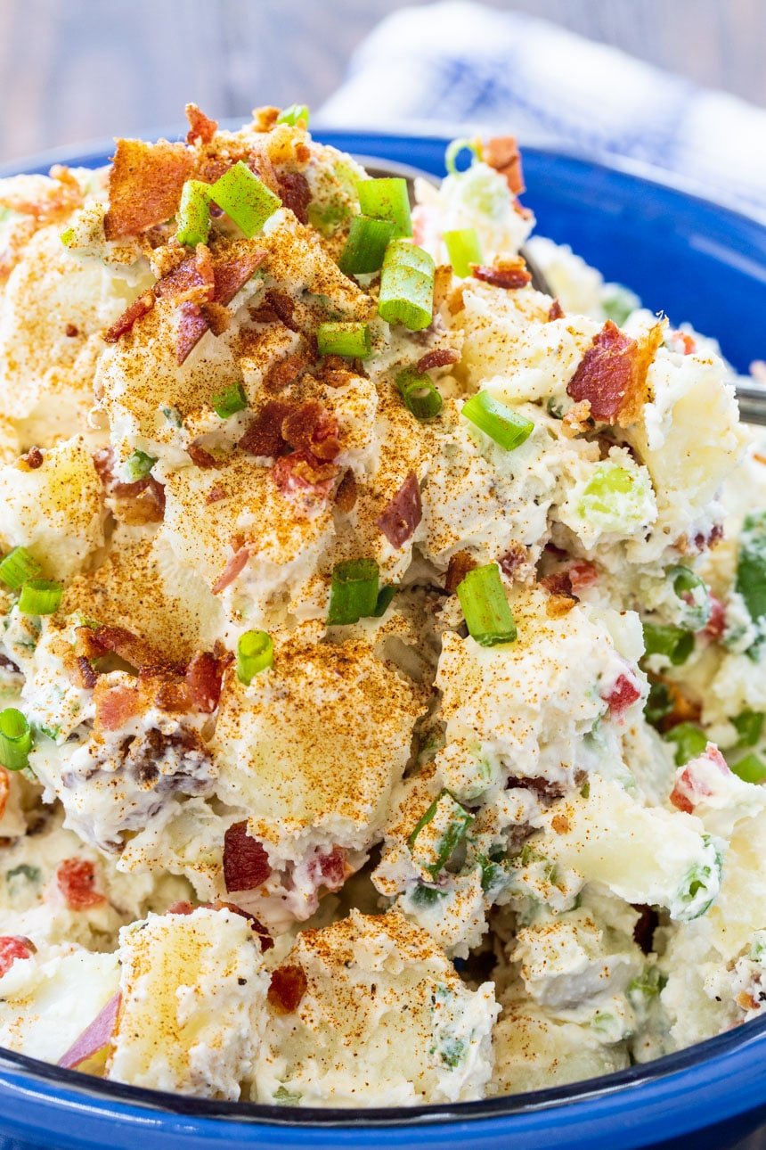 Bacon Potato Salad in a blue serving bowl