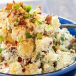 Potato Salad with Bacon in a blue serving bowl