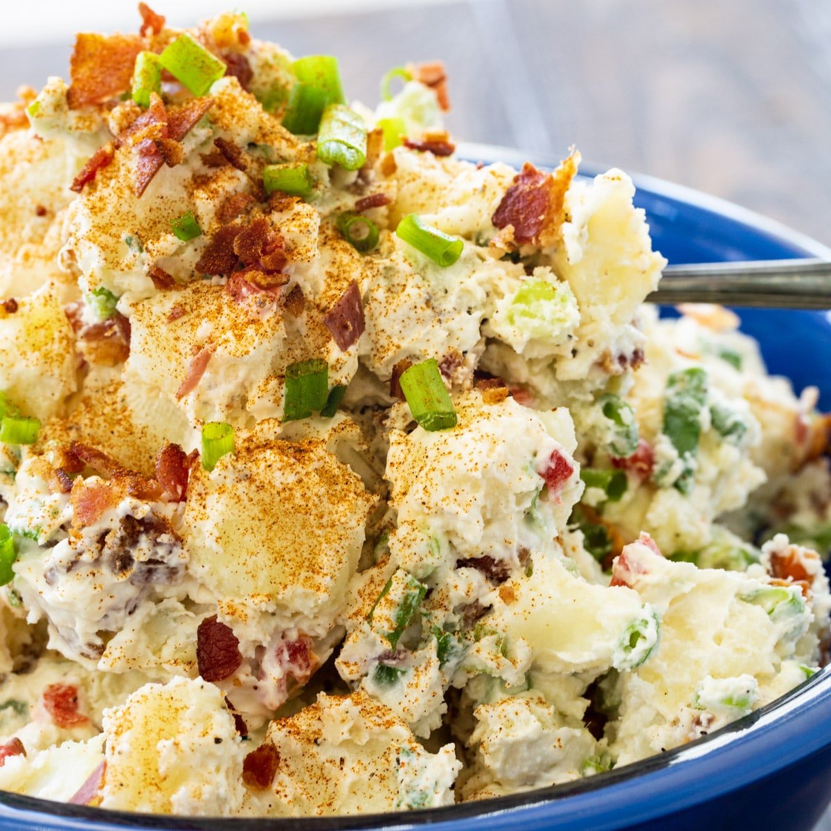 Bacon Potato Salad in a large blue bowl.