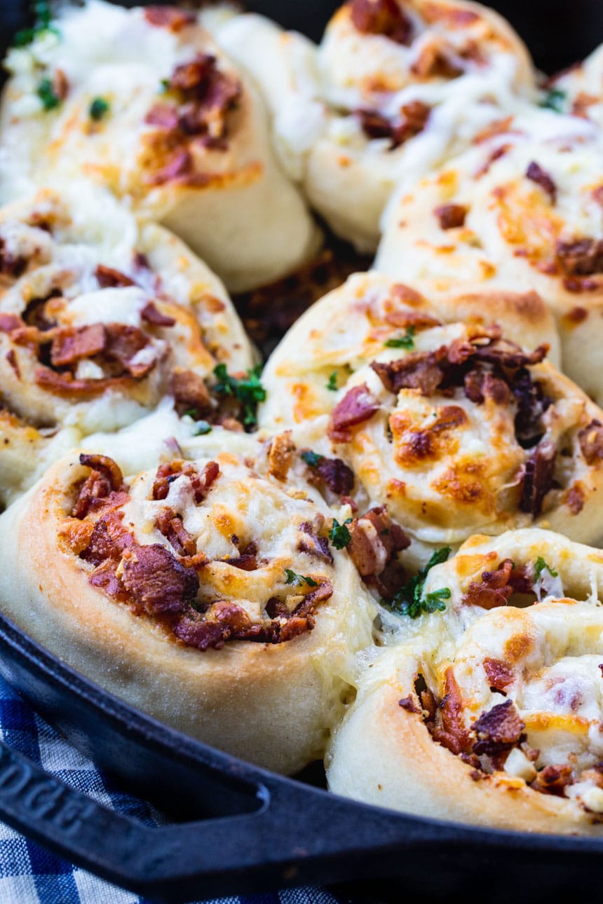 Bacon filled pizza pinwheels made in a cast iron pan.