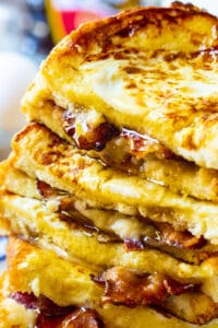 Bacon Stuffed French Toast stacked on a plate.