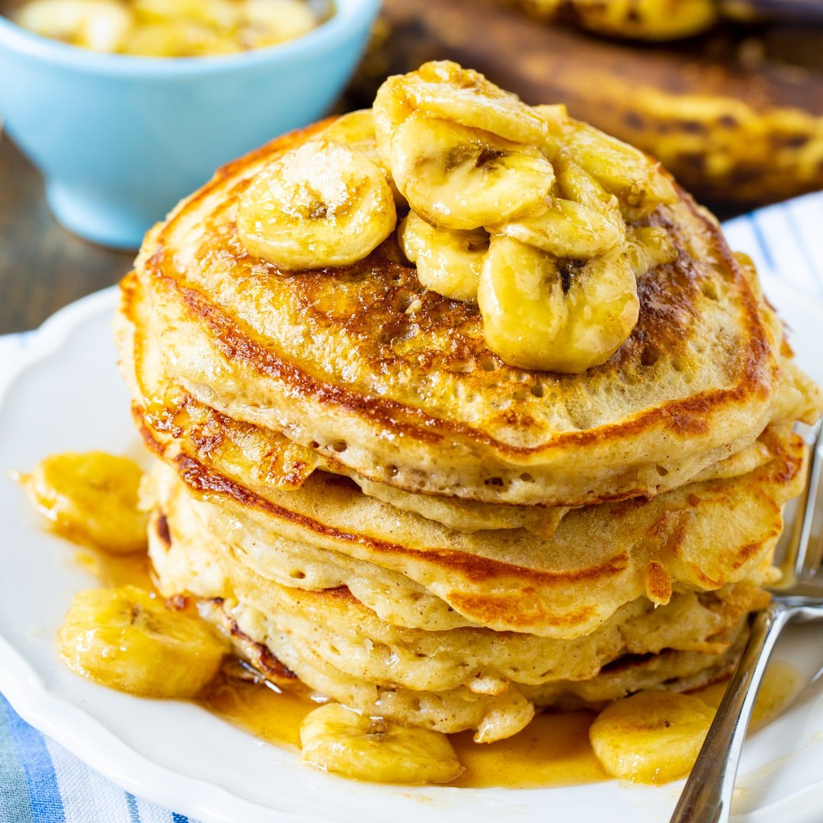 Stack of Banana Pancakes with Caramel Syrup on a plate.