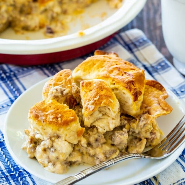 Slice of Biscuits and Gravy Pie on a plate.