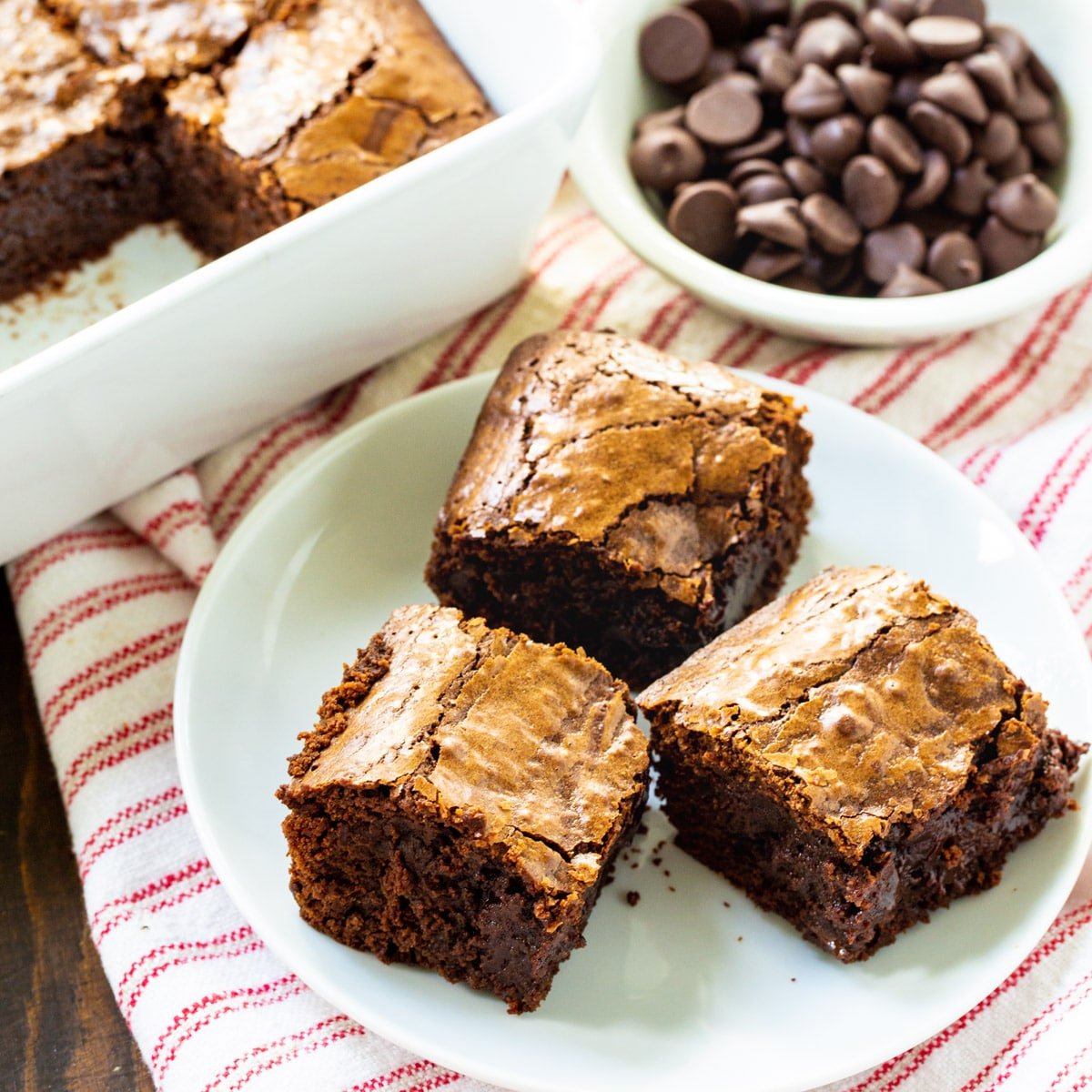 Three Bittersweet Chocolate Brownies on a plate.