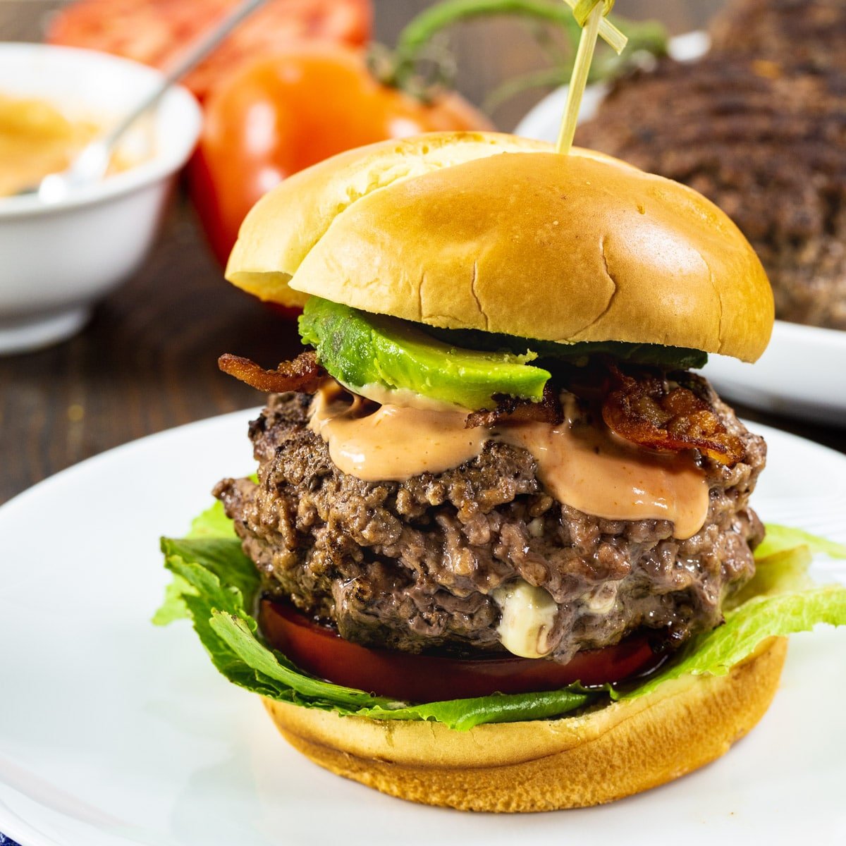 Black and Blue Burgers on toasted brioche buns with bacon and avocado.