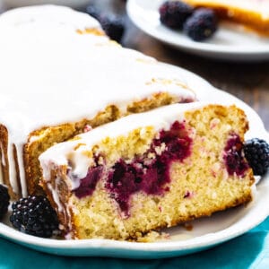 Blackberry Buttermilk Loaf Cake with a slice cut.