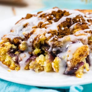 slice of blueberry coffee cake on a plate.