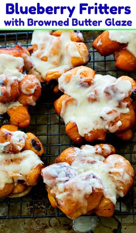 Fresh Blueberry Fritters covered in glaze.