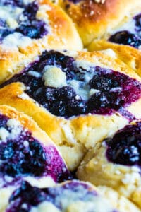 Blueberry Kolaches on a baking tray.