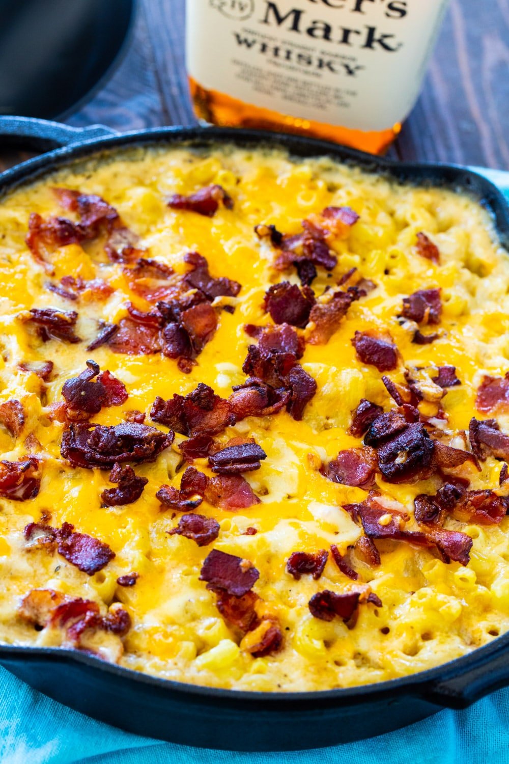 Mac and Cheese topped with bacon in a cast iron pan.