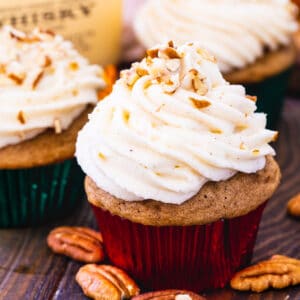 Bourbon ans Spice Cupcakes surrounded by pecan halves.