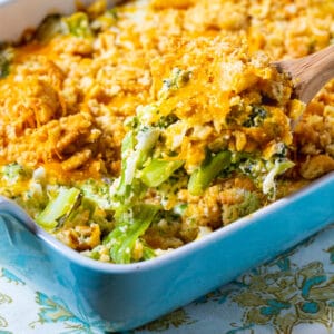 Wooden spoon scooping up Southern Broccoli Casserole.